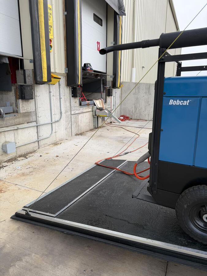Dock repair completed onsite to restore loading access and minimize downtime.